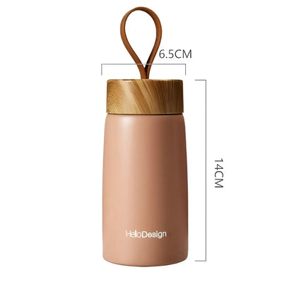 Insulated tea bottle size comparison showing compact 14 cm height