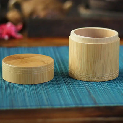 Bamboo tea canister with loose leaf tea inside
