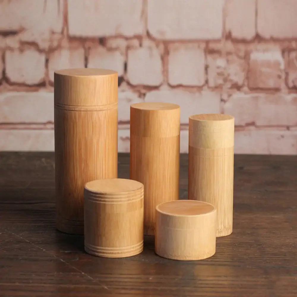 Set of bamboo tea canisters in S, M, L, XL and XXL sizes side by side