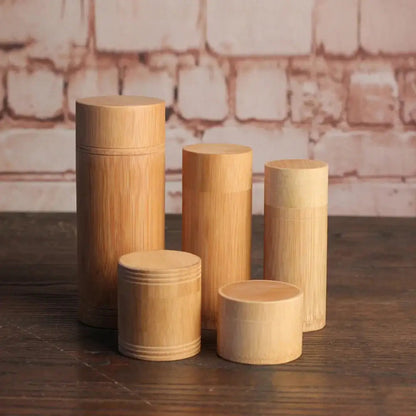 Set of bamboo tea canisters in S, M, L, XL and XXL sizes side by side