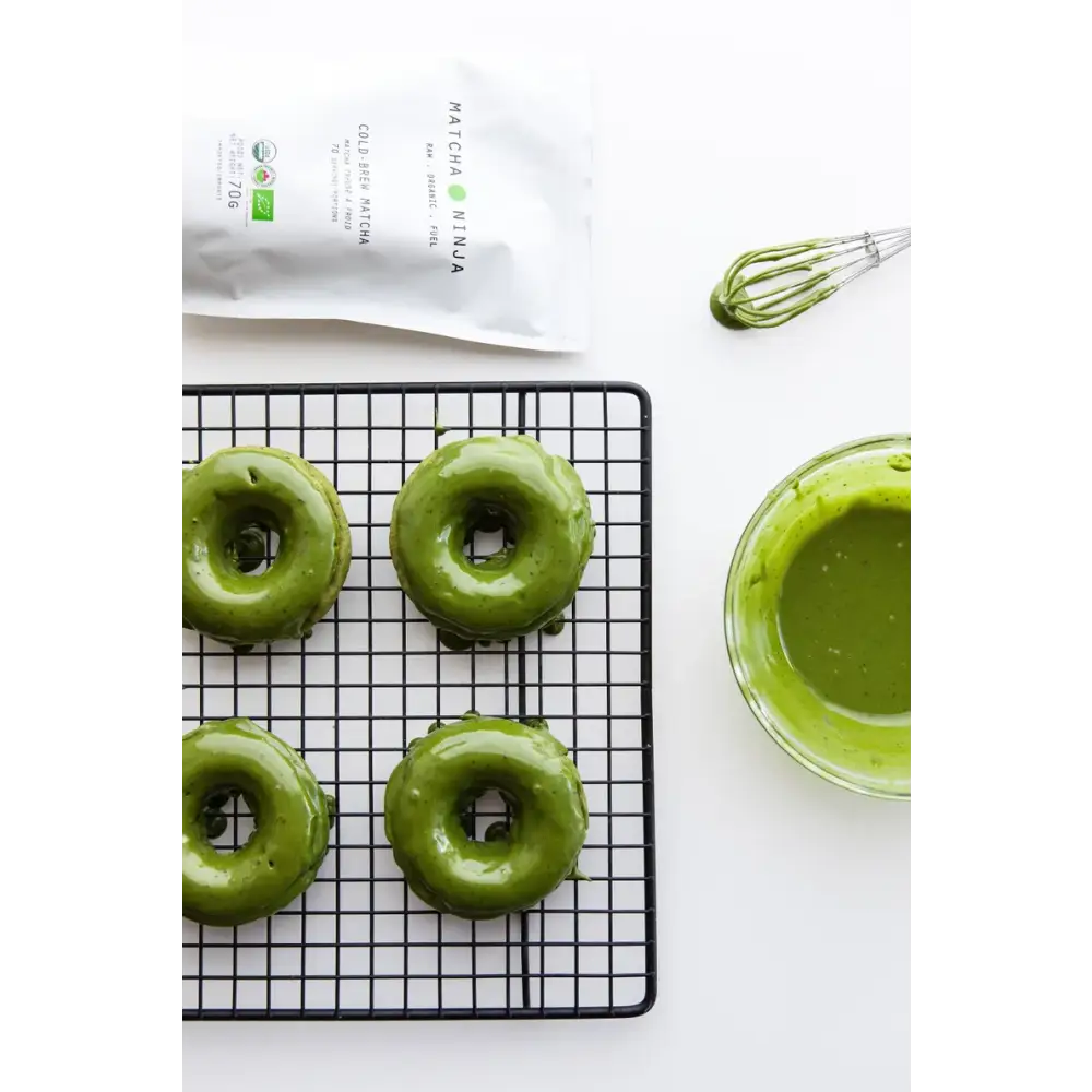 Prepared matcha green tea in a cup with steam