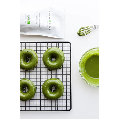Prepared matcha green tea in a cup with steam