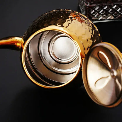 Large 1.8-liter stainless steel teapot on kitchen counter, side view