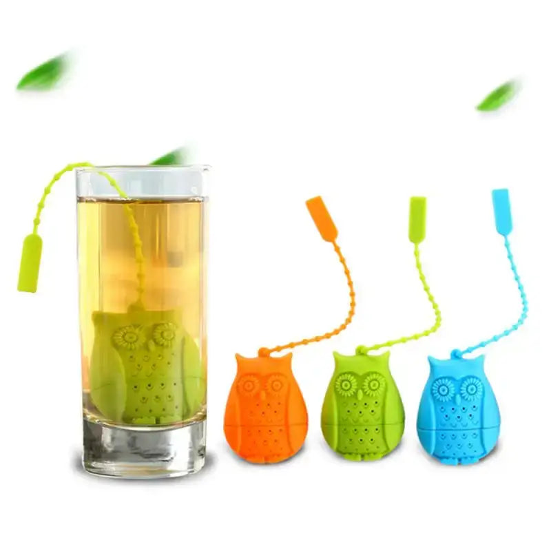 Cute owl tea strainer with tea leaves inside