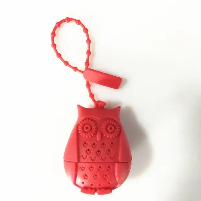 Red owl tea infuser in a cup of tea