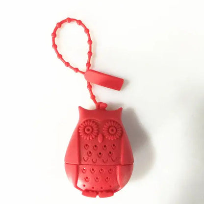 Red owl tea infuser in a cup of tea