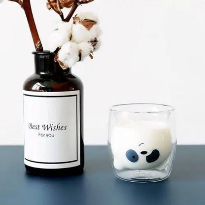 Panda glass tea cup on table with tea