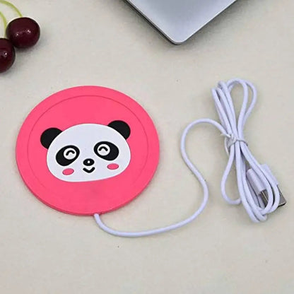 Panda mug warmer on a desk with a cup of tea