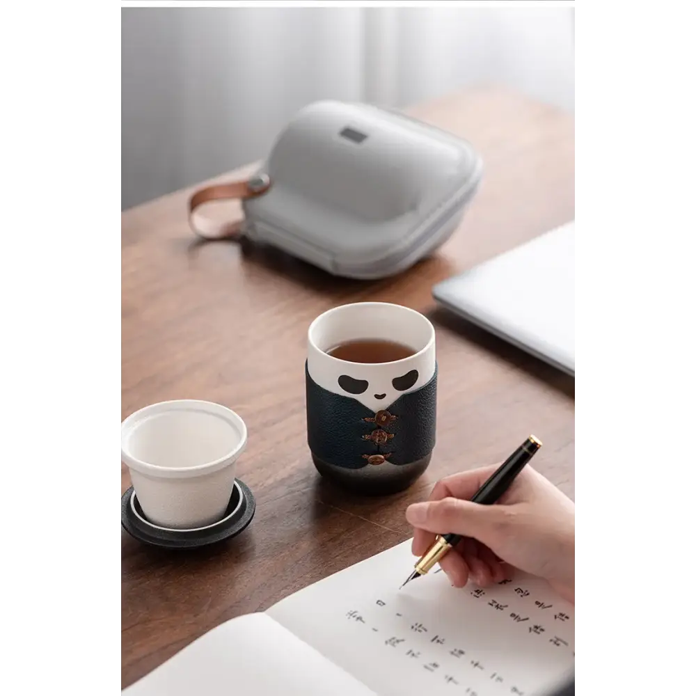 Panda tea infuser with black tea in a glass cup