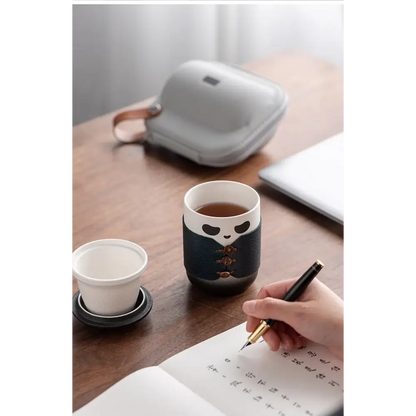 Panda tea infuser with black tea in a glass cup