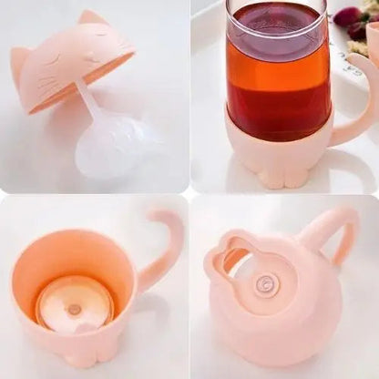 Pink cat tea cup components laid out, cup and fish infuser separate