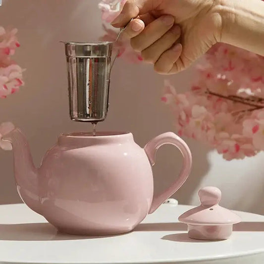 Sakura pink teapot on kitchen table