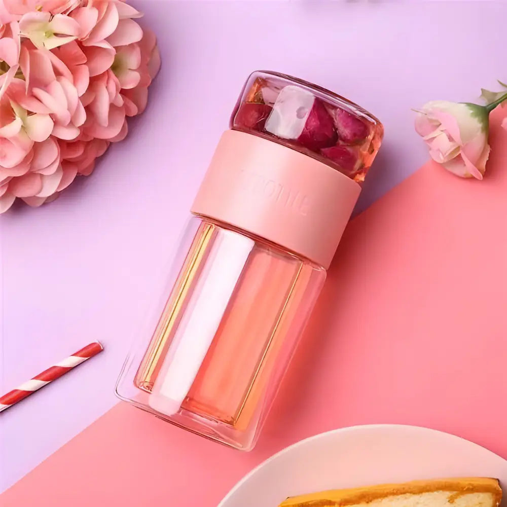 Pink glass tea thermos with infuser full product view