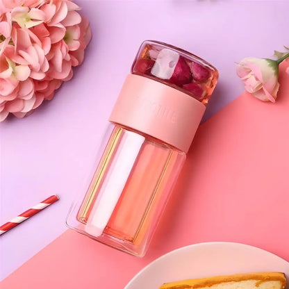 Pink glass tea thermos with infuser full product view