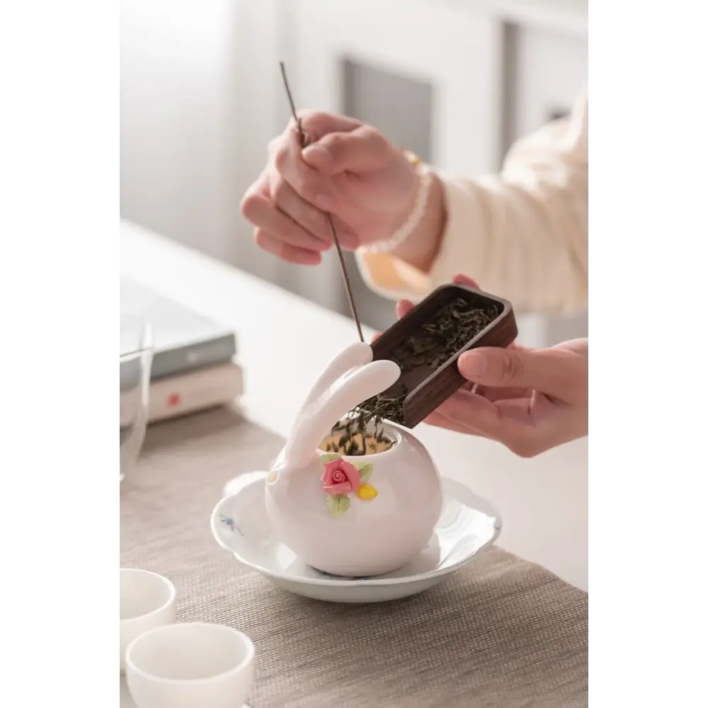 Cute pink rabbit porcelain teapot side view