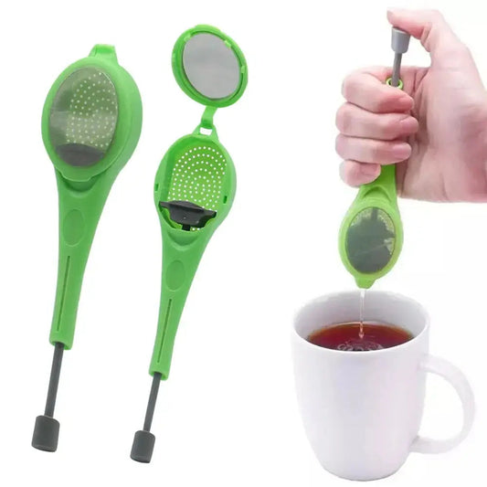 Tea infuser pressing loose tea leaves in a mug