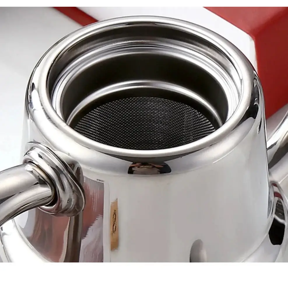 Mirror-finish stainless steel teapot on kitchen counter, lid off showing infuser