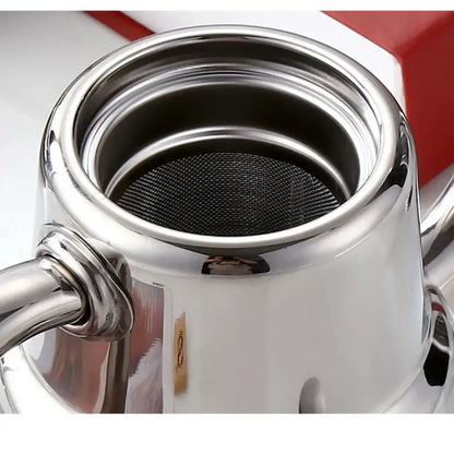 Mirror-finish stainless steel teapot on kitchen counter, lid off showing infuser