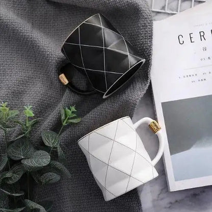 Polygon tea cup in white ceramic on a table