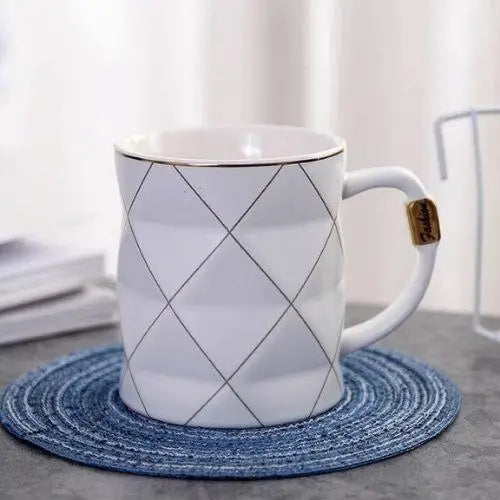 White polygon tea cup with geometric design
