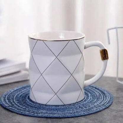 White polygon tea cup with geometric design