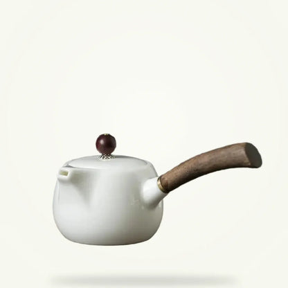 Porcelain Teapot with Infuser, product photo on a plain background