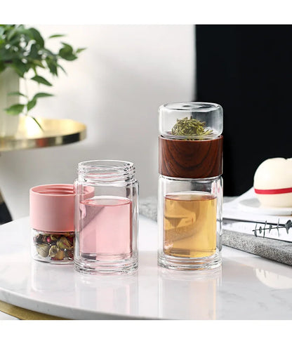 Loose leaf infuser lifted from glass teapot after steeping, stopping over-extraction