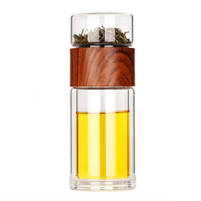 Portable glass teapot with loose leaf infuser on office desk, 300 ml capacity