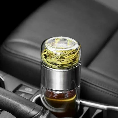 Portable tea infuser bottle with sleeve on a desk