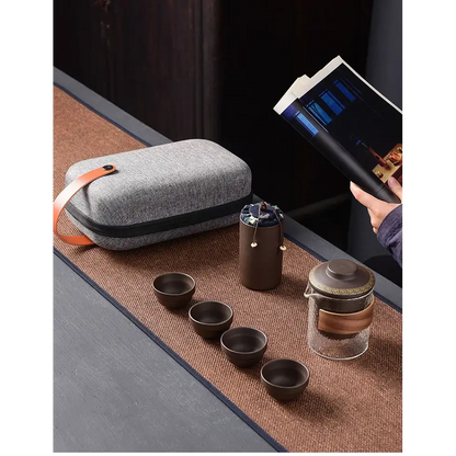 Purple clay tea set with cups and open carrying case showing padded interior