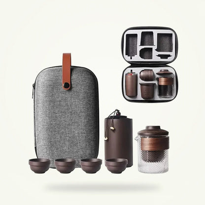 Purple clay travel tea set with carrying case, Zisha teapot and cups on plain background