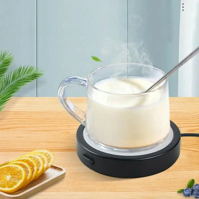 Rechargeable mug warmer with white mug on top
