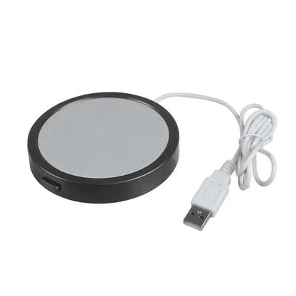 Black rechargeable mug warmer on desk