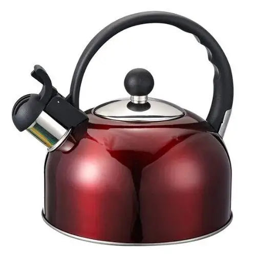 Red enamel stovetop whistling kettle with spout whistle on gas burner
