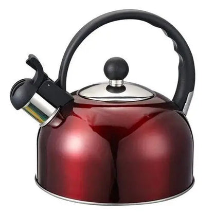 Red enamel stovetop whistling kettle with spout whistle on gas burner