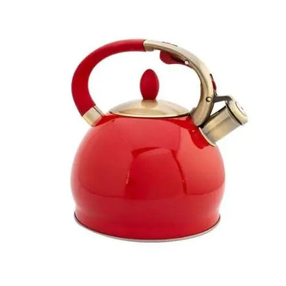 Red vintage whistling tea kettle on gas stove