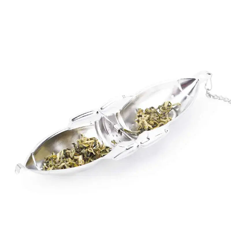 Rocket tea infuser steeping in a mug