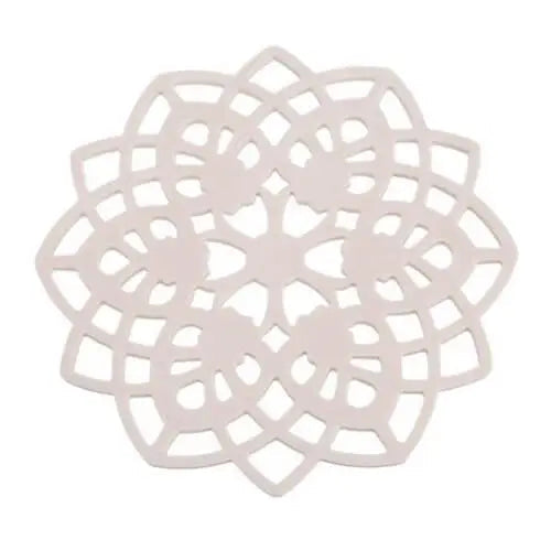 Beige rosette silicone teacup saucer on table