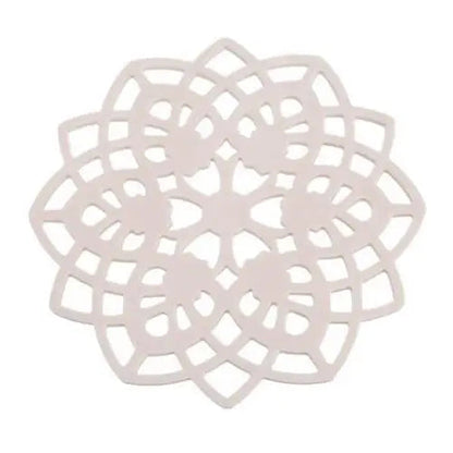 Beige rosette silicone teacup saucer on table