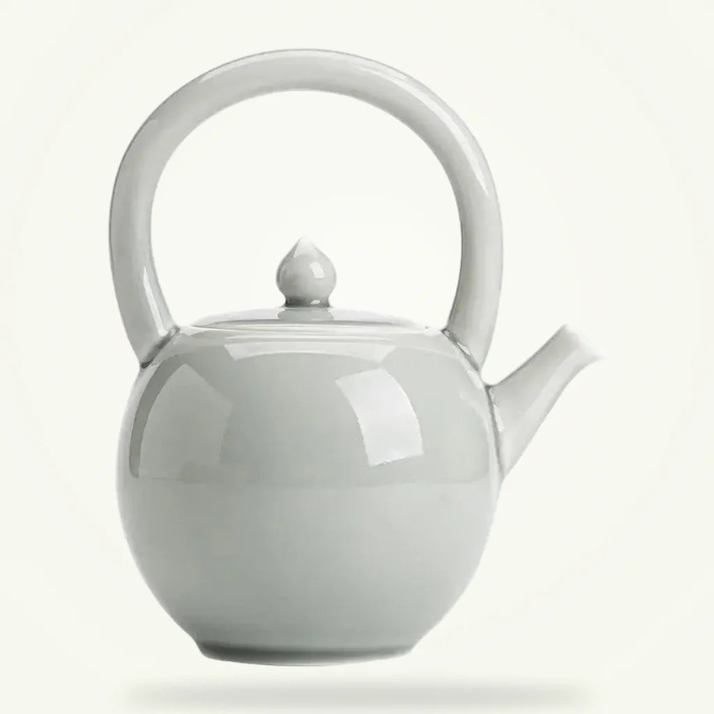Round Porcelain Teapot 2L, Classic White Ceramic Teapot for Loose Leaf Tea, product photo on a plain background