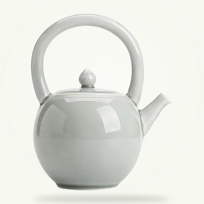 Round Porcelain Teapot 2L, Classic White Ceramic Teapot for Loose Leaf Tea, product photo on a plain background