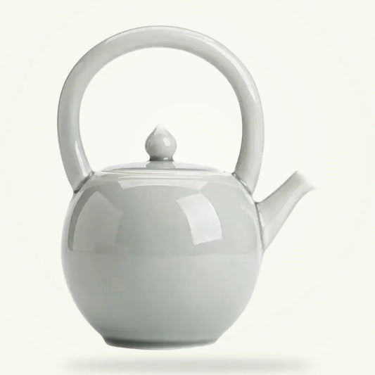 Round Porcelain Teapot 2L, Classic White Ceramic Teapot for Loose Leaf Tea, product photo on a plain background