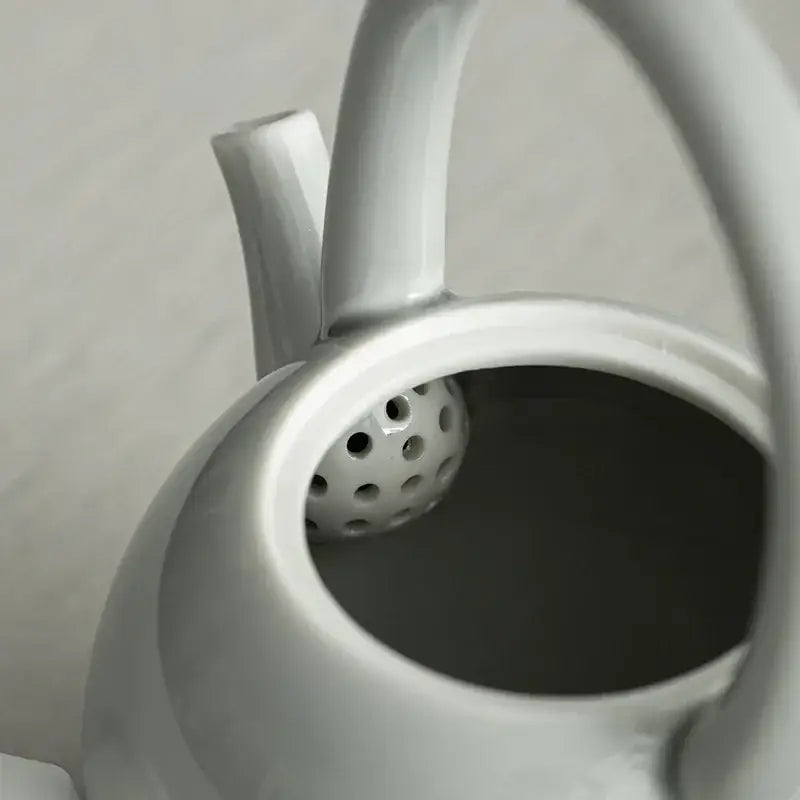 Porcelain teapot with lid and handle