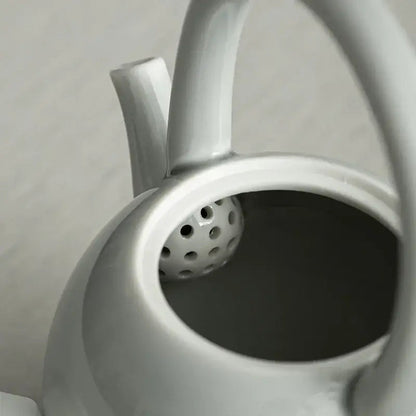 Porcelain teapot with lid and handle