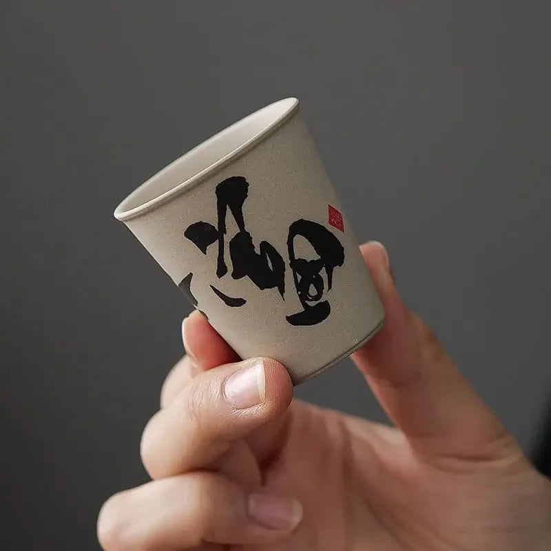 Illustrated wooden keepsake box open with rustic ceramic tea cups inside