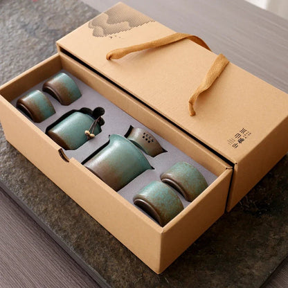 Complete rustic green ceramic gaiwan tea set arranged on surface