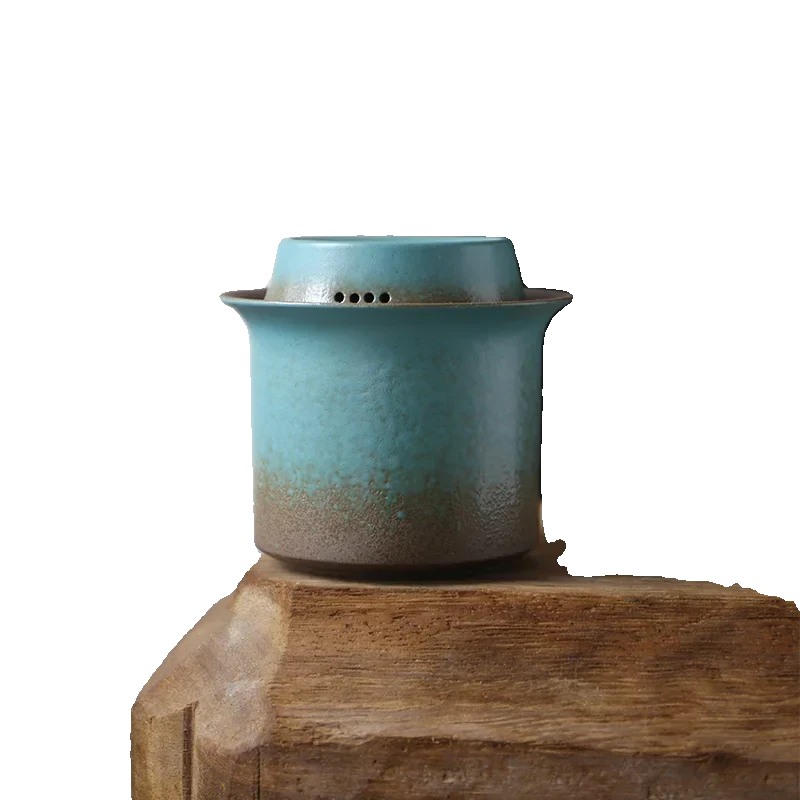 Gaiwan infuser with filter lid open showing loose tea leaves inside