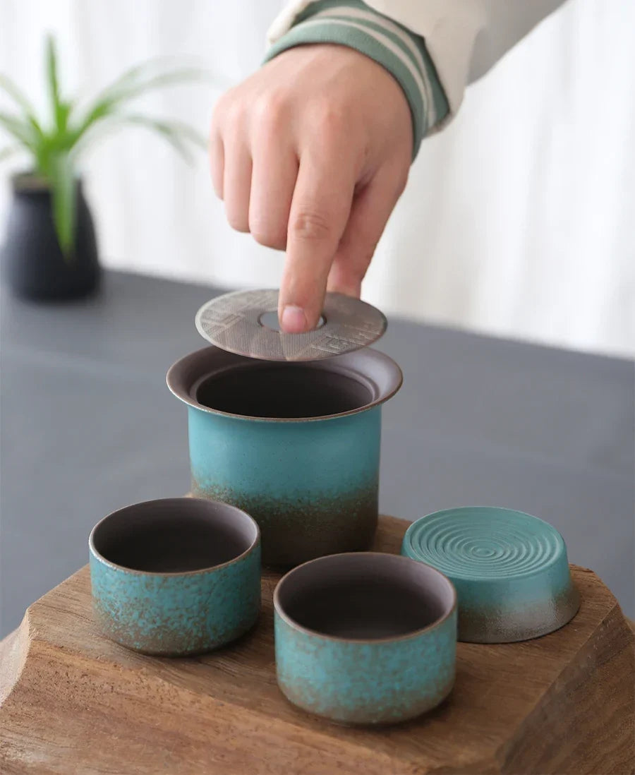 Green ceramic tea storage jar with fabric lid and rope detail