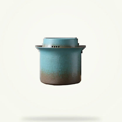 Rustic green ceramic teapot set with gaiwan infuser, 8 pieces on plain background