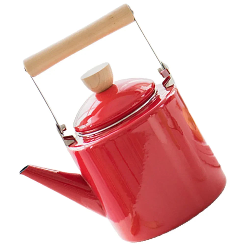 Red Scandinavian ceramic teapot on a kitchen table setting